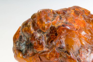 Macro Close up of an amber stones from Baltic sea. Multicolored background for advertising and banners. Vintage fossilized resin as a background. Yellow amber texture close up. Stone with inclusions