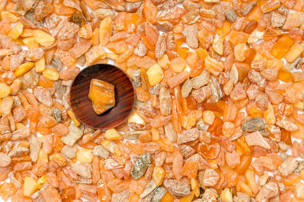Macro Close up of an amber stones from Baltic sea. Multicolored background for advertising and banners. Vintage fossilized resin as a background. Red amber Close up. Stone with inclusions
