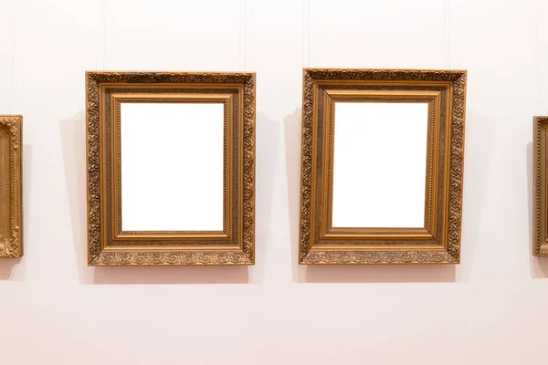 Blank empty frames hanging on museum wall. Art gallery, museum exhibition white clipping path