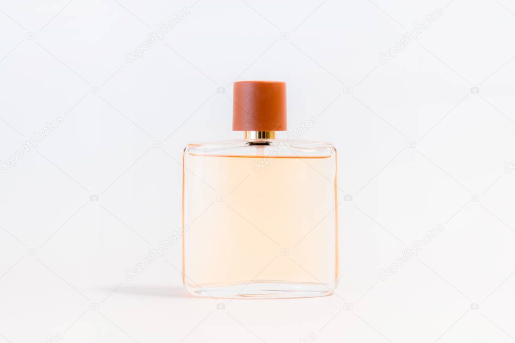 Luxury glass perfume bottle on white background. Copy space for text, blank bottle