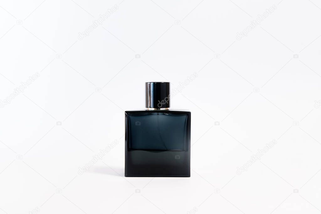 Luxury glass perfume bottle on white background. Copy space for text, blank bottle
