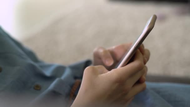 Teenage Girl Blue Dress Laying Sofa While Holding Smart Phone — Stock Video