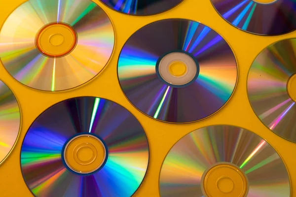 Vintage CD o DVD de fondo de disco, viejos discos de círculo utilizados para el almacenamiento de datos, compartir películas y música —  Fotos de Stock