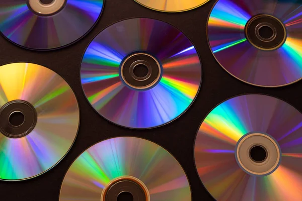 Vintage CD o DVD de fondo de disco, viejos discos de círculo utilizados para el almacenamiento de datos, compartir películas y música —  Fotos de Stock