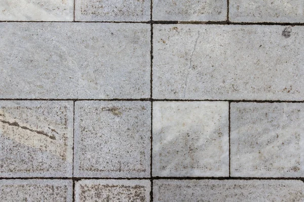 Concrete tile texture. City pavement background. Abstract stone brick pattern. Street sidewalk texture.