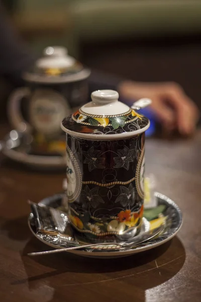 Two tea cups on the table in the afternoon