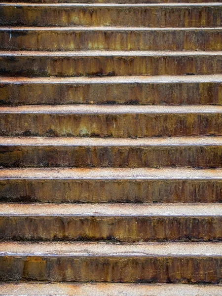 Rusty metal stairs on an afternoon sun