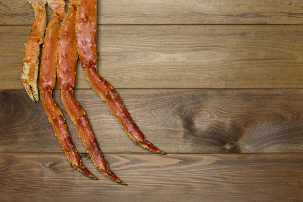 Luxusnahrung Krabbenkrallen Auf Braunem Holzhintergrund — Stockfoto