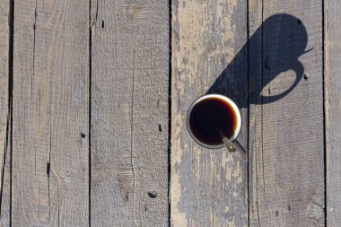 Çay kaşık, tahta arka plan ile