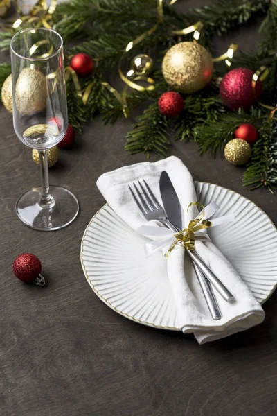 Holiday Christmas place setting with fork and knife, ribbon and christmas decorations, Christmas background