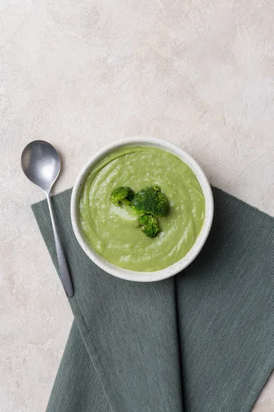 Broccoli cream soup in bowl on concrete background — Stock Image Broccoli cream soup in bowl on concrete background Stock Photo