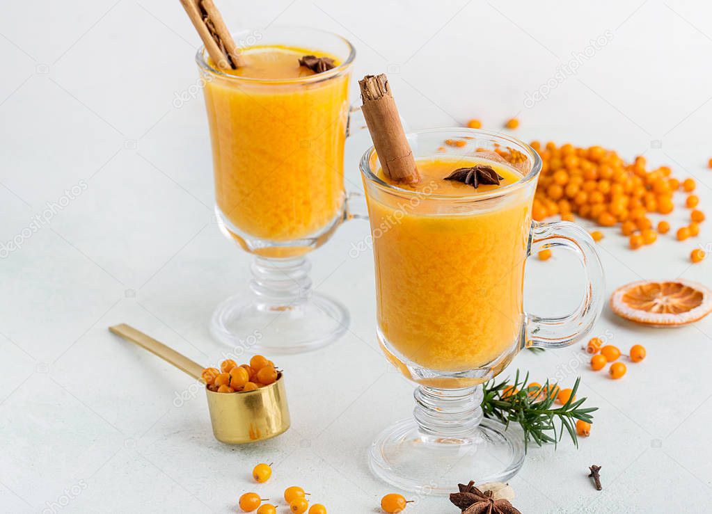 Banner with hot beverages as sea buckthorn on white background