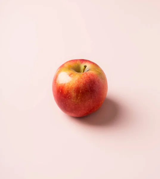 stock image Seasonal apple fruit at pink solid background. Minimal concept of harvest seasonal raw fruit