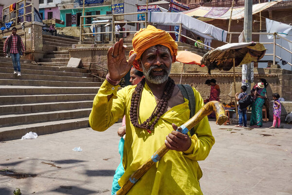 Varanasi, INDIA - MAY 29, 2017: Indian yogis in traditional attire on a street in Varanasi