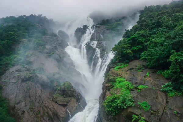 The huge waterfall Dudsagar in the wild jungle. Karnataka, India