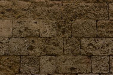 Eski kahverengi tebeşir tuğla duvar. Yunan antik mimarisi, eski tuğla duvar taş desen