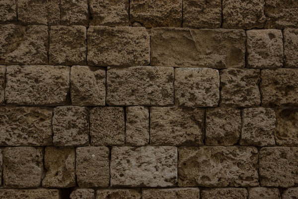 Old brown chalk brick wall. Greek ancient architecture, stone Pattern of old brick wall