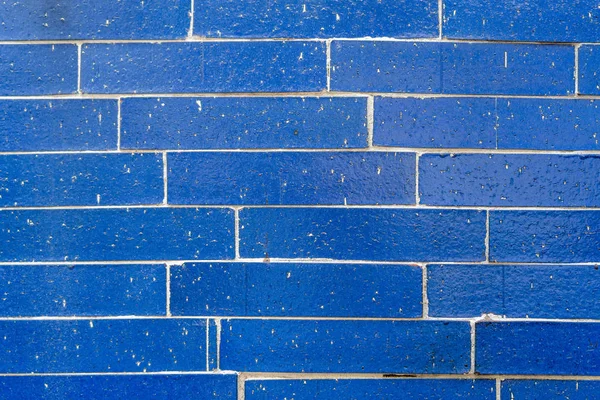 Brick wall of blue color. Colored background. Copy space