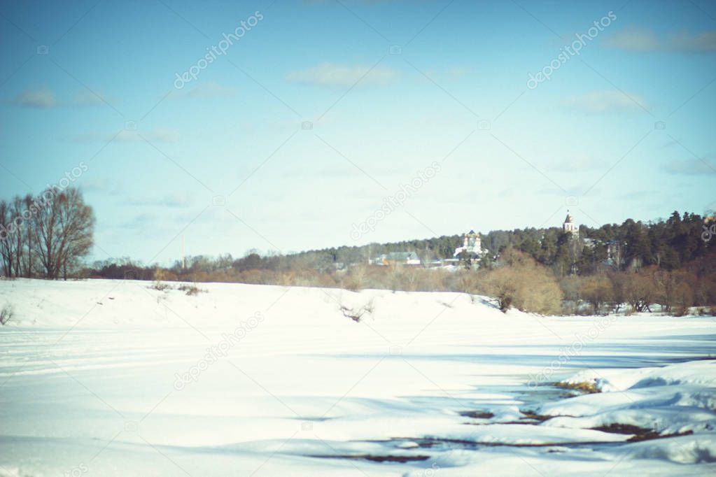 White snow on a small river in Russia in winter