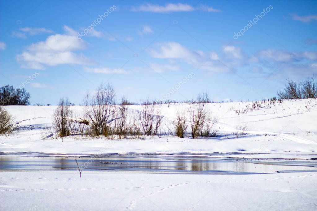 White snow on a small river in Russia in winter