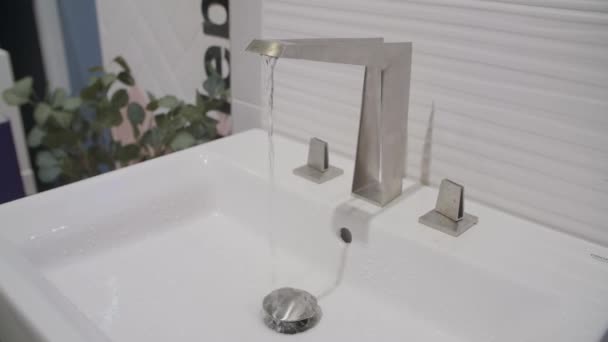 Slow Motion Water Flows Chrome Faucet — Stock Video