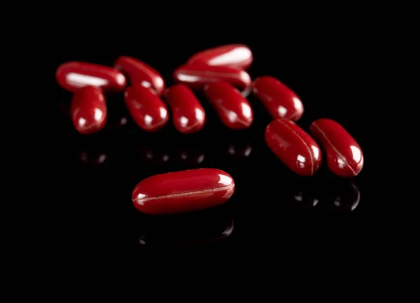 Capsules Sur Fond Noir — Photo