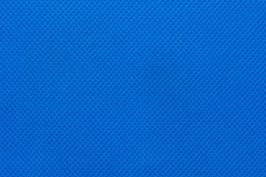 arka plan ve doku olarak mavi dokuma olmayan kumaş yüzeyine