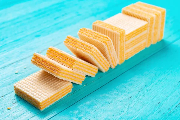cheese wafer blocks on blue background