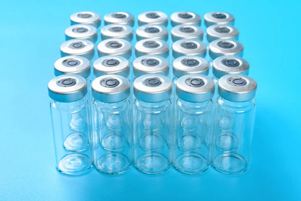 Angle View Empty Vaccine Bottles Blue Background — Stock Photo, Image