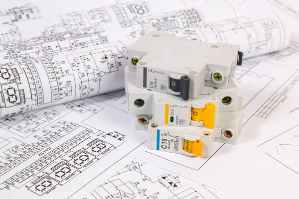 Electrical engineering drawings and modular circuit breaker. Electrical network protection and switching. — Stock Photo, Image