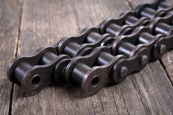 Industrial driving roller chain. Part of the chain drive of machine-building mechanism.