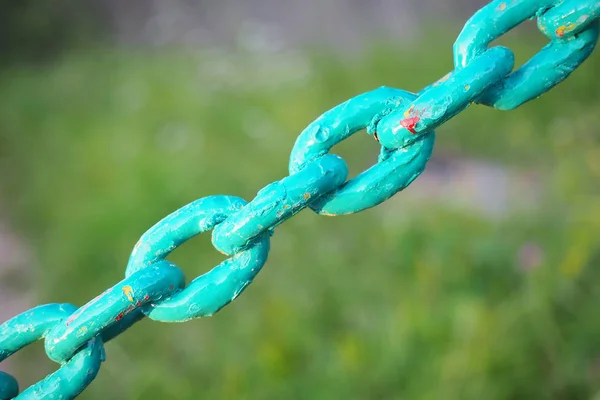 colored chain links close-up no green background