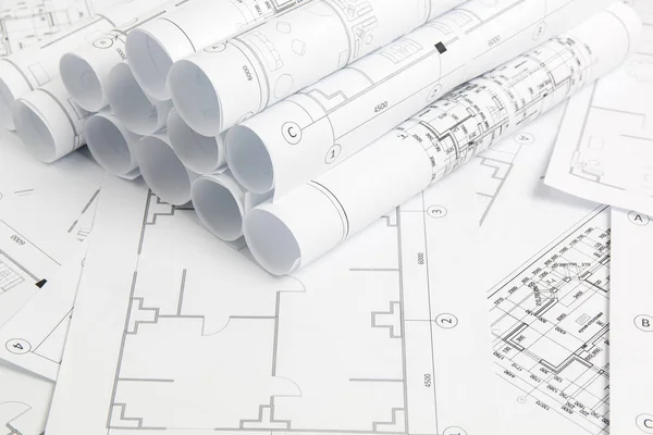 Dibujos arquitectónicos de papel y planos. Proyecto de ingeniería Imagen De Stock