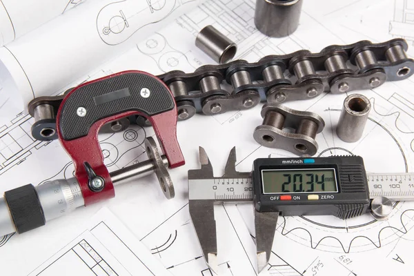 Driving roller chain, caliper and micrometer on engineering drawings
