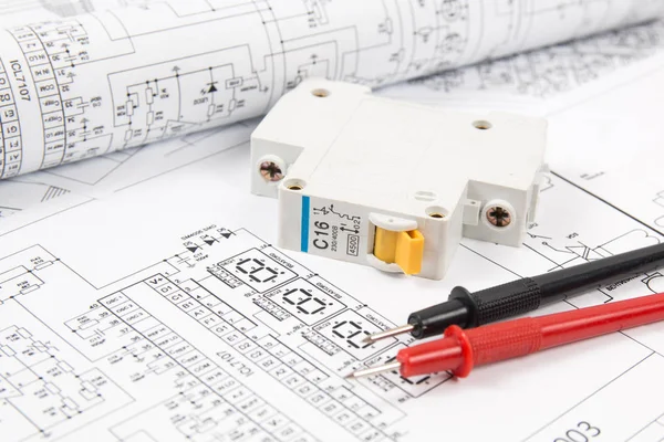 Science, technology and electronics. Electrical engineering drawings printing with circuit breaker and mulyimeter. Scientific development. — Stock Photo, Image