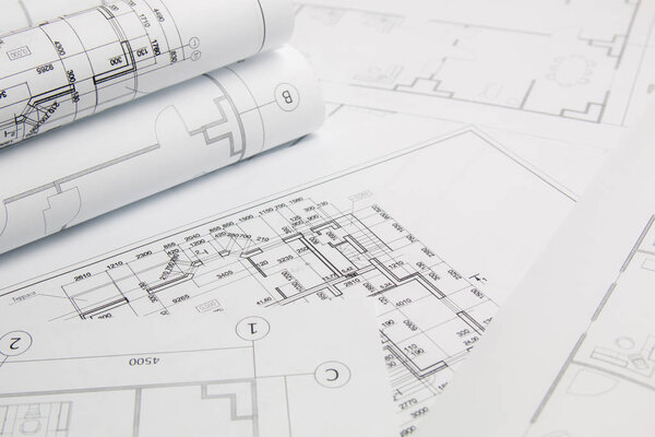 Paper architectural drawings and blueprints