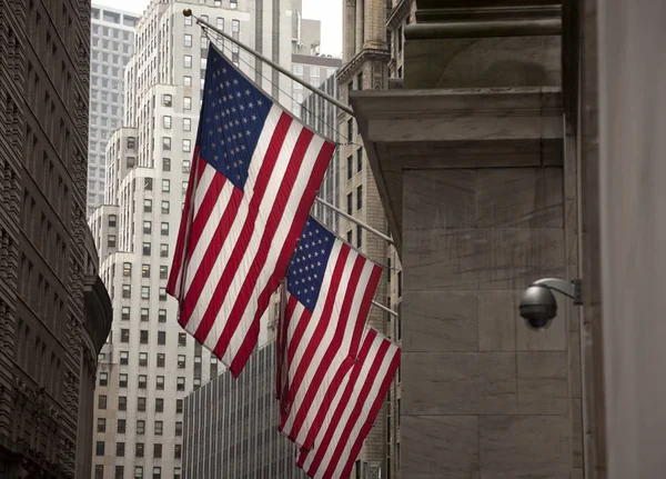 Use flag near an security camera in a facade of Manhattan