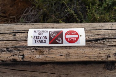 Sign warning hikers to stay on the trails and do not enter, forest restoration area in progress clipart