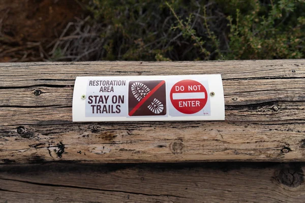 Sign warning hikers to stay on the trails and do not enter, forest restoration area in progress