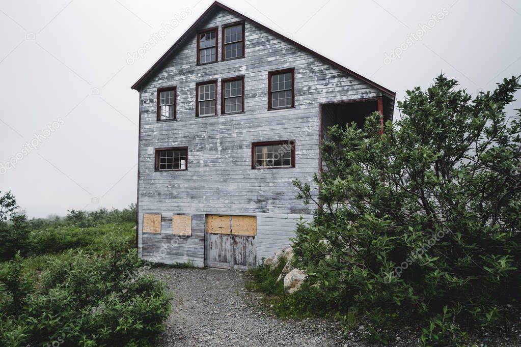 Boarded up abandoned mining building at Alaska's Independence Mine ghost town along Hatcher Pass