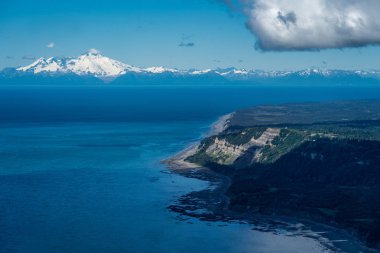Aerial photography view of Alaska's Cook Inlet with a clear view of Mount Redoubt in Homer Alaska clipart