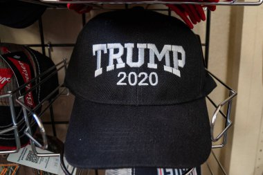 JULY 3 2018 - HOLBROOK ARIZONA: A Donald Trump hat supporting republican President Trump's reelection in 2020 sits for sale in a gift shop. clipart