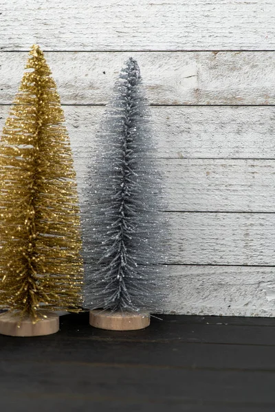 Sparkly Gold Silver Bottle Brush Christmas Trees Wooden Background Portrait — Stock Photo, Image