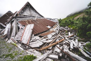 Ruins of an old abandoned mining building at Independence Mine along Alaska's Hatcher Pass clipart