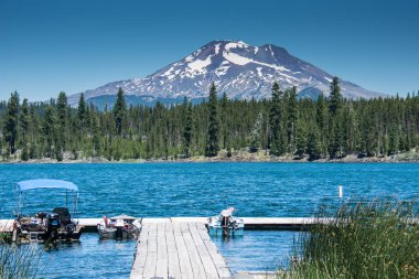 Lava Lake, along the Cascade Lakes Scenic Byway near Bend Oregon, with Mt. Bachelor in the backgrou clipart