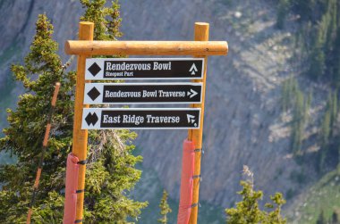 JUNE 22 2017 - JACKSON HOLE, WYOMING: Signs for black diamond and double black diamond runs at the downhill ski resort of Jackson Hole during summer months. In ski season, the runs are expert only. clipart