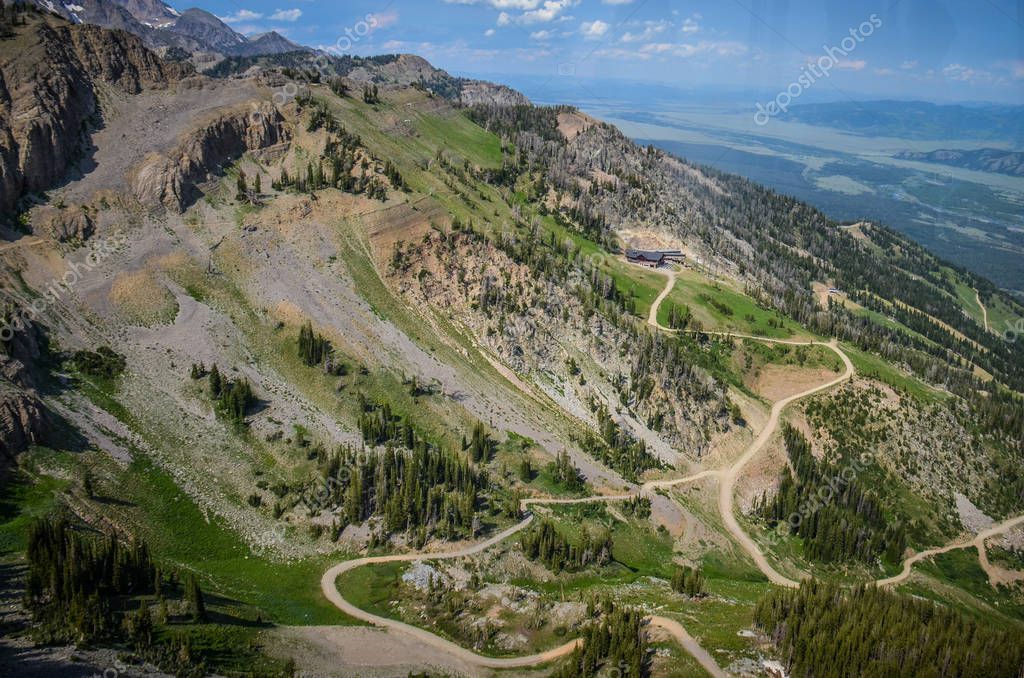 Trails and dirt roads through the Grand Tetons mountains in Jackson Hole Wyoming during the summer. Aerial view