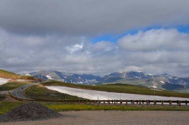 Beartooth Highway Pass in Montana on a sunny summer day clipart