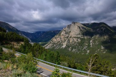 Beartooth Highway Pass in Montana on a sunny summer day. No cars on road, concept for road trip clipart