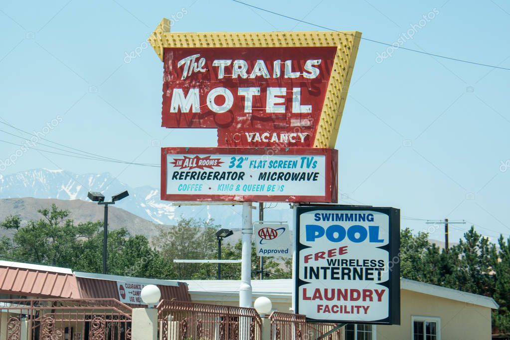 JULY 3 2017 - LONE PINE, CALIFORNIA: Vintage motel sign for The Trails Motel in downtown Lone Pine, a popular spot for hikers on the Pacific Crest Trail in the summer